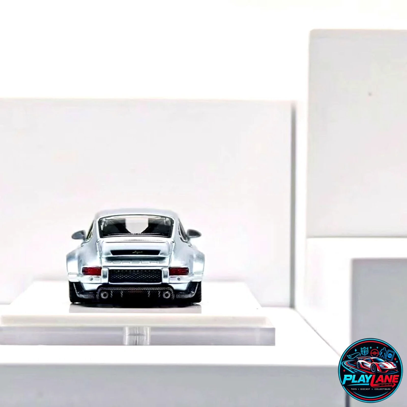 Zincit Model 1:64 Singer Reimagined 911 (964) DLS (Dynamics and Lightweight Study) - Ice Blue Metallic Limited Edition Resin/Die-Cast Collector Model Car with Acrylic Display Case - Main View 2
